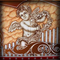old style retro cupid angel art paint on ferris wheel using airbrush